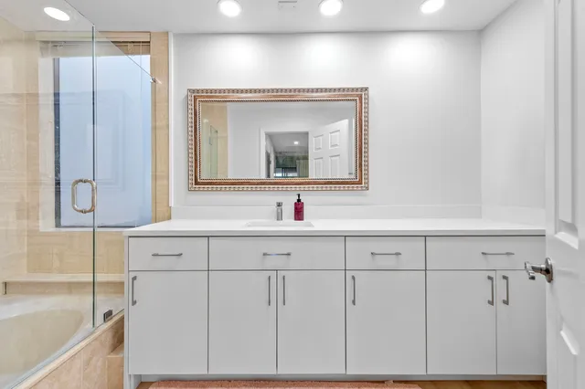 a bathroom with a sink and a mirror