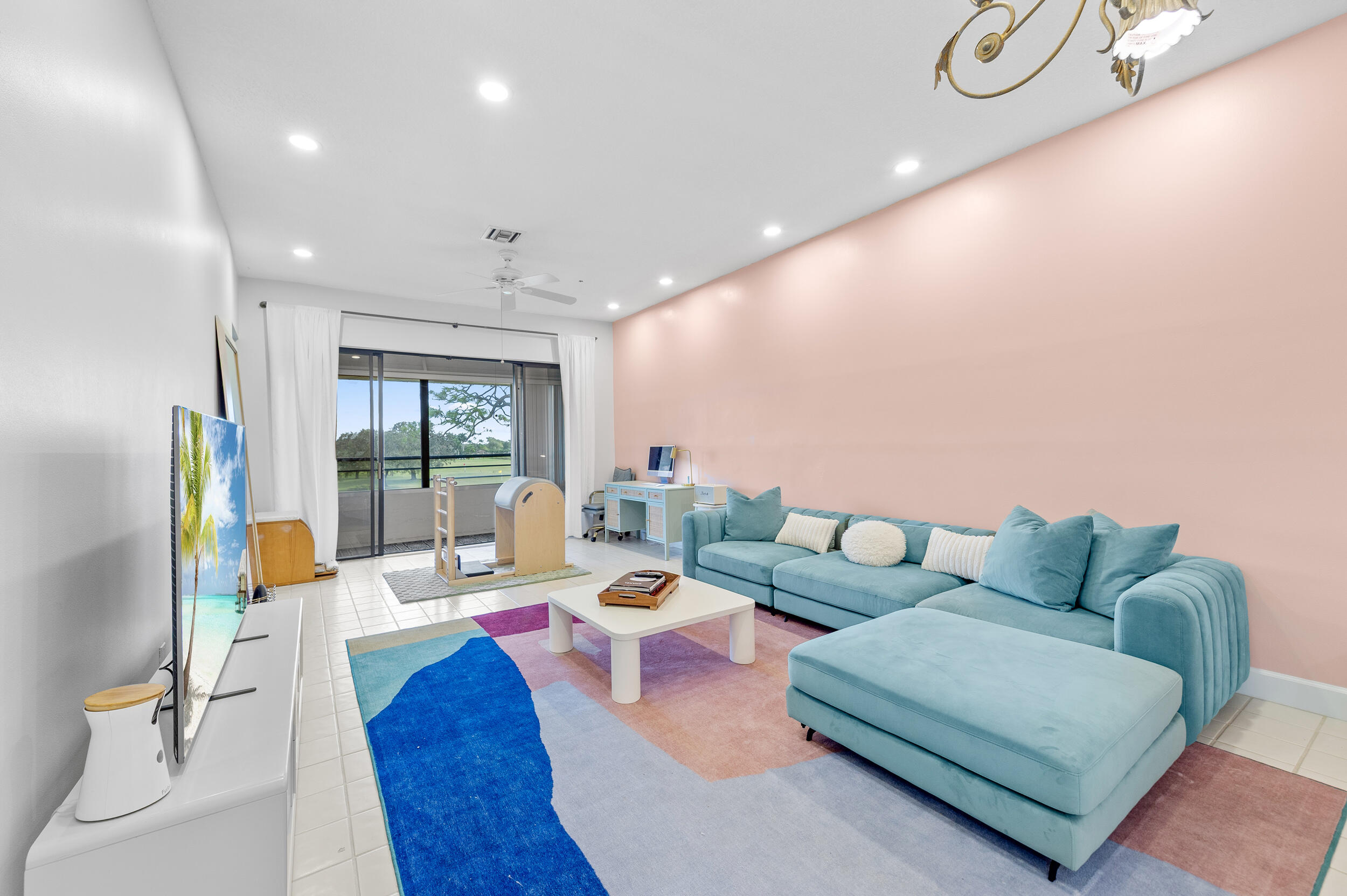 7460 La Paz Boulevard, Unit 304 Boca Raton, FL 33433 - Photo 22 of 37 a living room with furniture and a large window