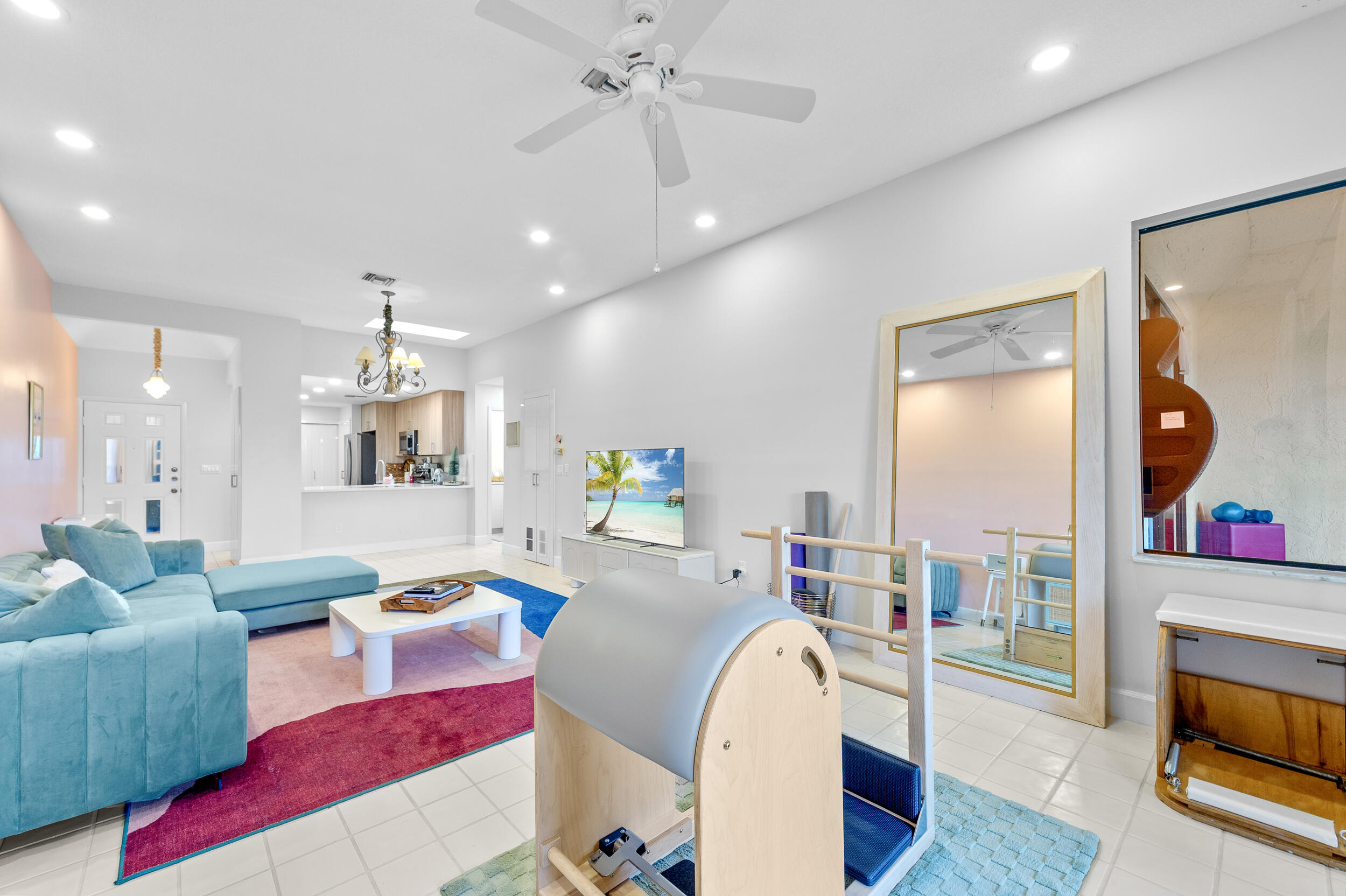 7460 La Paz Boulevard, Unit 304 Boca Raton, FL 33433 - Photo 3 of 37 a living room with furniture and a flat screen tv