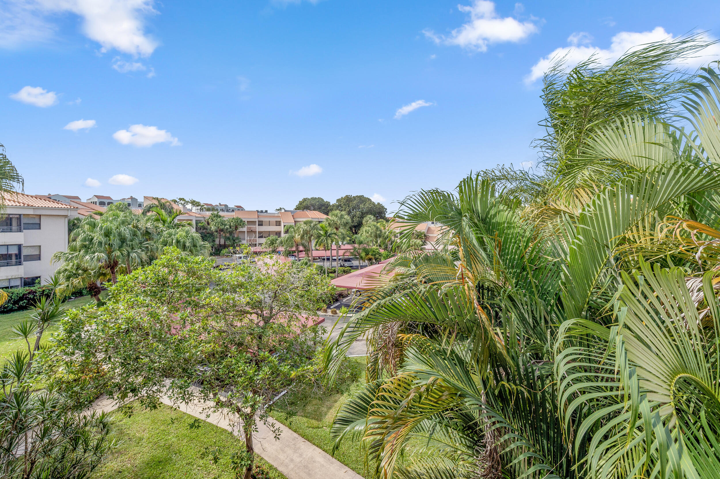 7460 La Paz Boulevard, Unit 304 Boca Raton, FL 33433 - Photo 31 of 37 a view of a garden