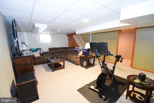a white toilet sitting next to a bathroom sink