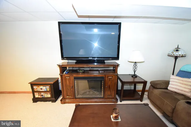 a living room with a couch and a flat screen tv