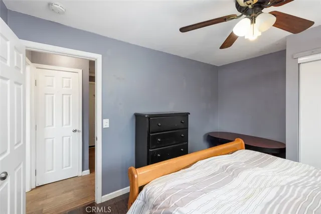 a bedroom with a bed and a closet