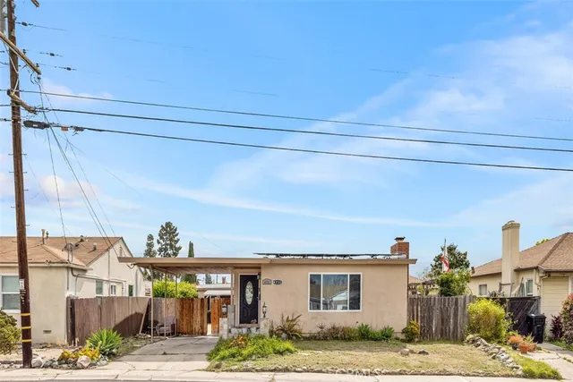 a view of a house with a street
