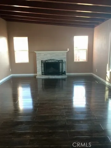 a view of a living room with a fireplace
