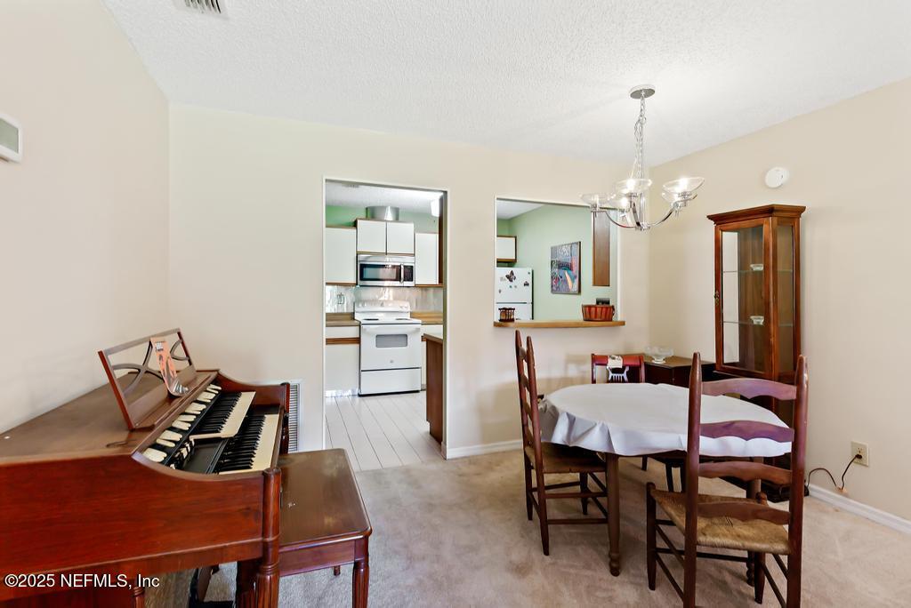 85 Debarry Avenue, Unit 1012 Orange Park, FL 32073 - Photo 15 of 55 Dining Area Looking Into Kitchen