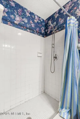 a view of a backyard with swimming pool