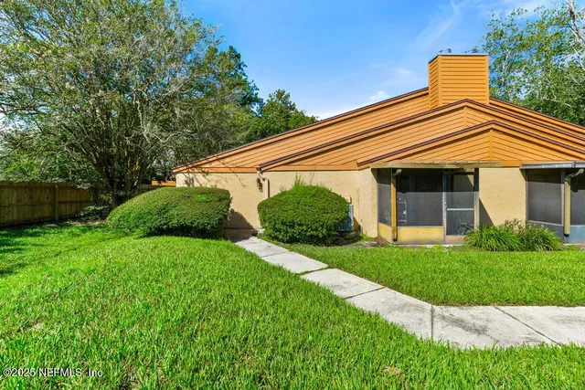 a house with trees in front of it