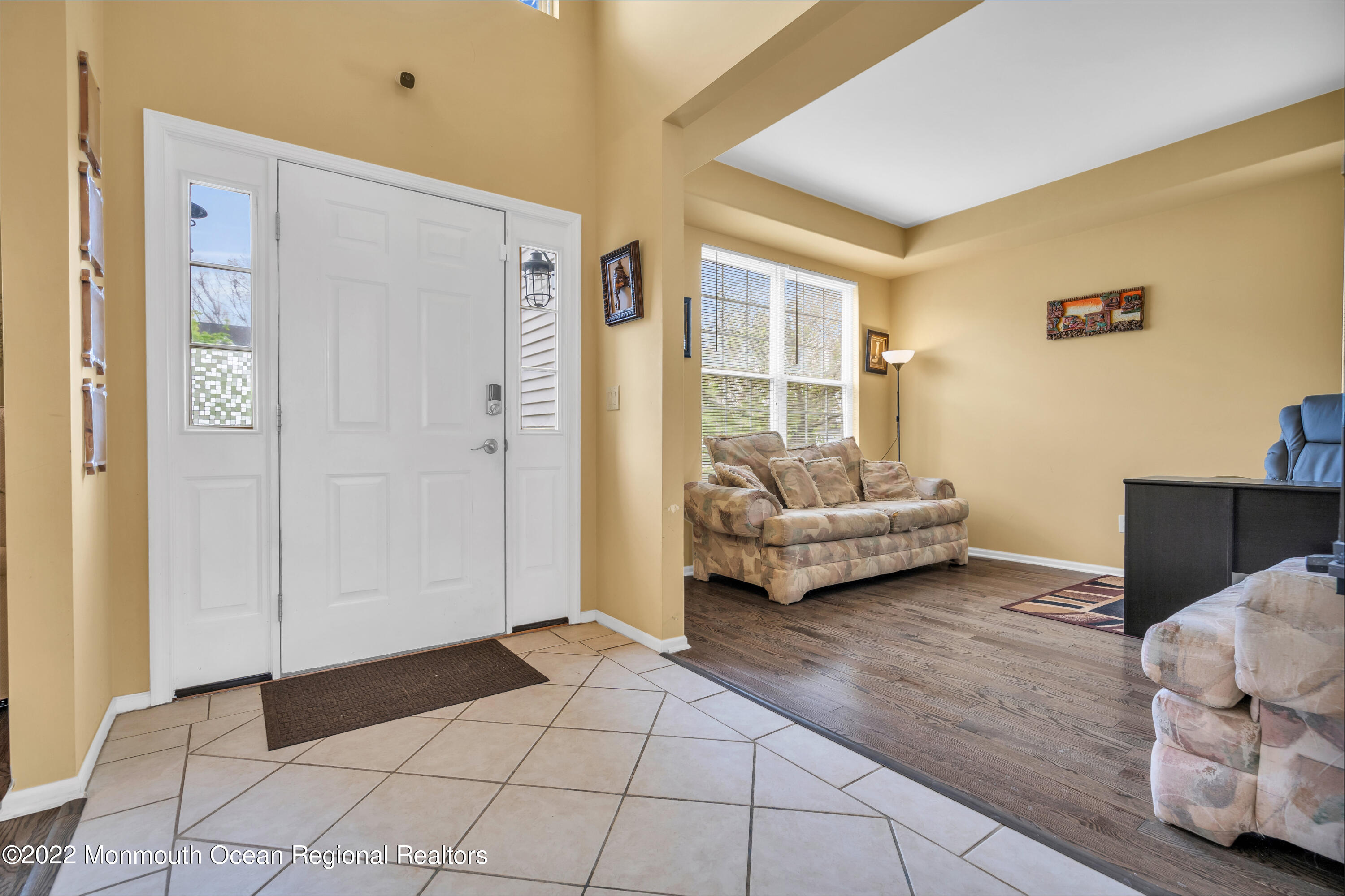 131 Nobility Court Toms River, NJ 08755 - Photo 16 of 60 a living room with furniture and a chandelier