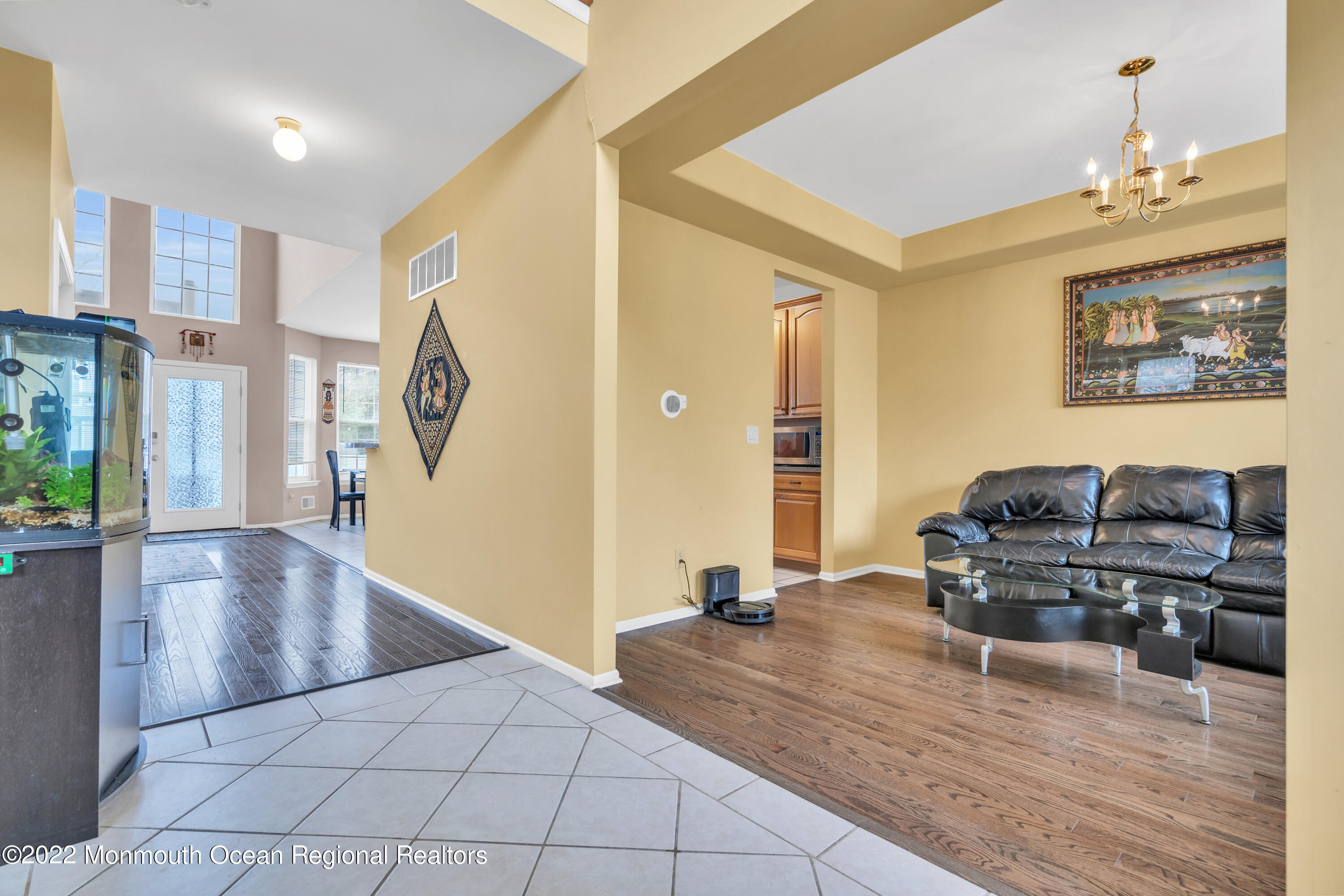 131 Nobility Court Toms River, NJ 08755 - Photo 19 of 60 a living room with furniture and a chandelier