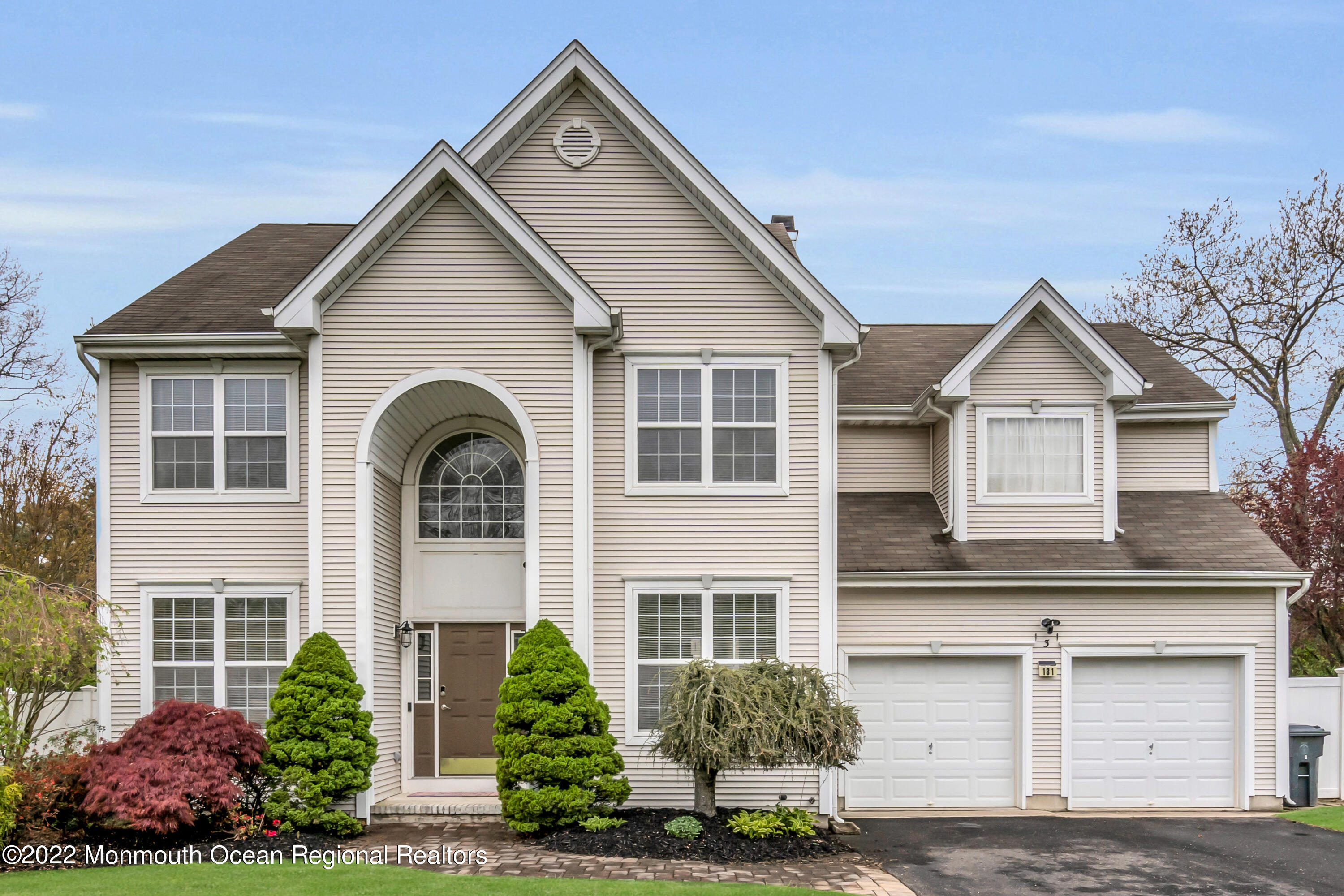 131 Nobility Court Toms River, NJ 08755 - Photo 2 of 60 a front view of a house with a garden