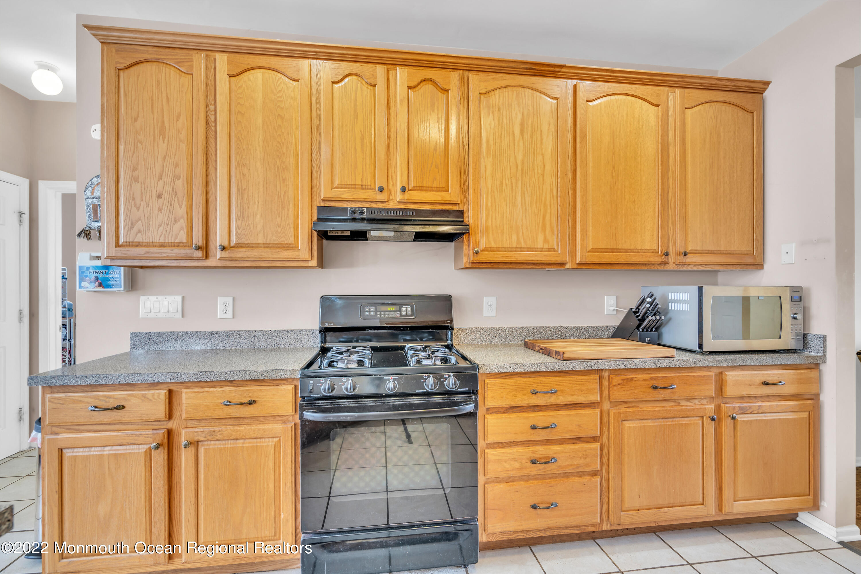 131 Nobility Court Toms River, NJ 08755 - Photo 25 of 60 a kitchen with stainless steel appliances granite countertop a stove a sink and cabinets