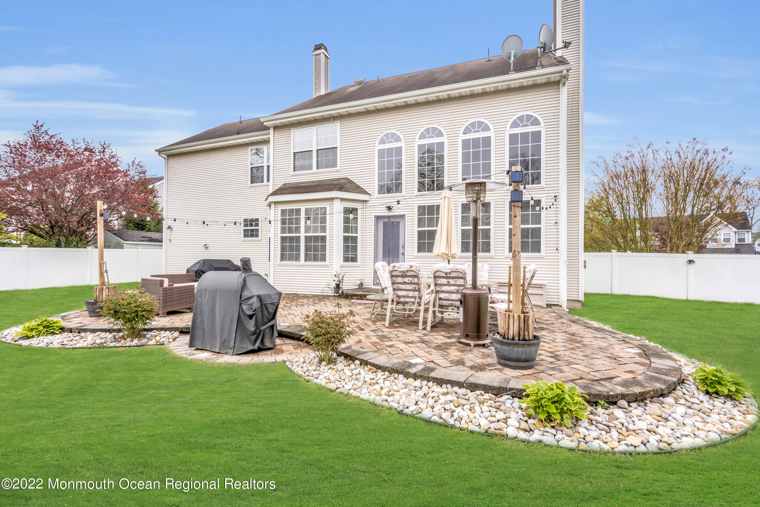 131 Nobility Court Toms River, NJ 08755 - Photo 3 of 60 a front view of a house with a garden and yard