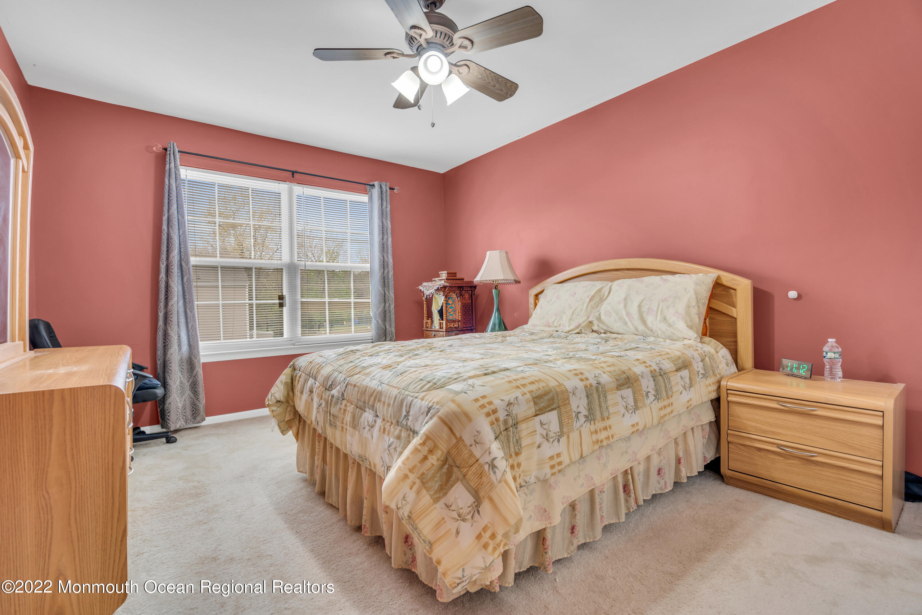 131 Nobility Court Toms River, NJ 08755 - Photo 35 of 60 a bedroom with a bed and a chandelier