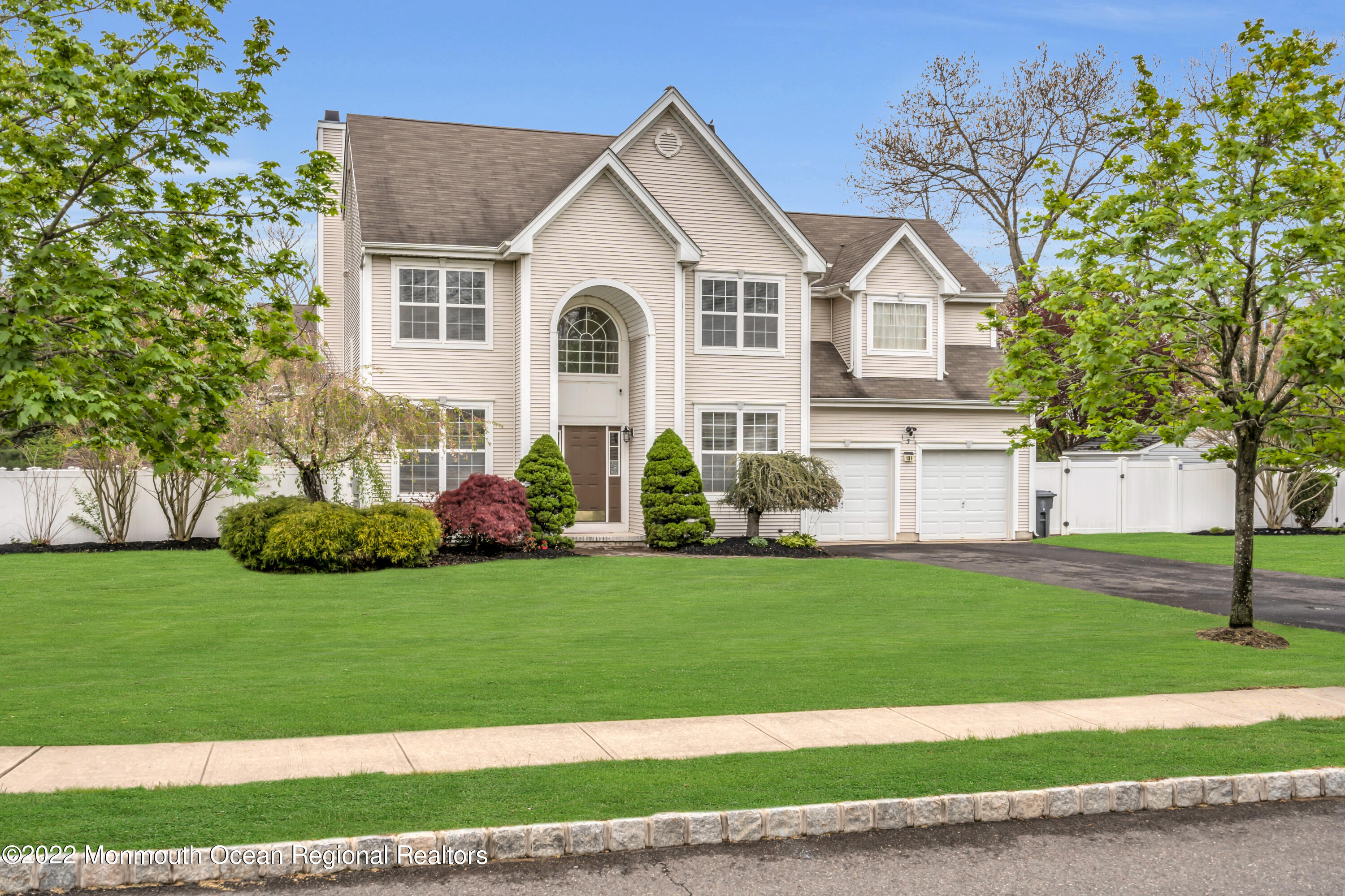 131 Nobility Court Toms River, NJ 08755 - Photo 4 of 60 a view of a white house with a yard and plants
