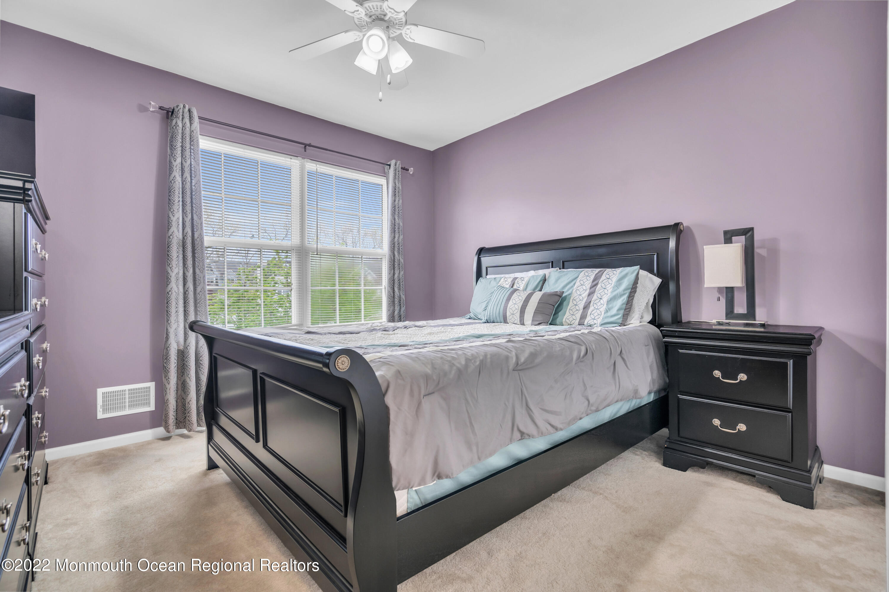 131 Nobility Court Toms River, NJ 08755 - Photo 41 of 60 a bedroom with a bed and a chandelier