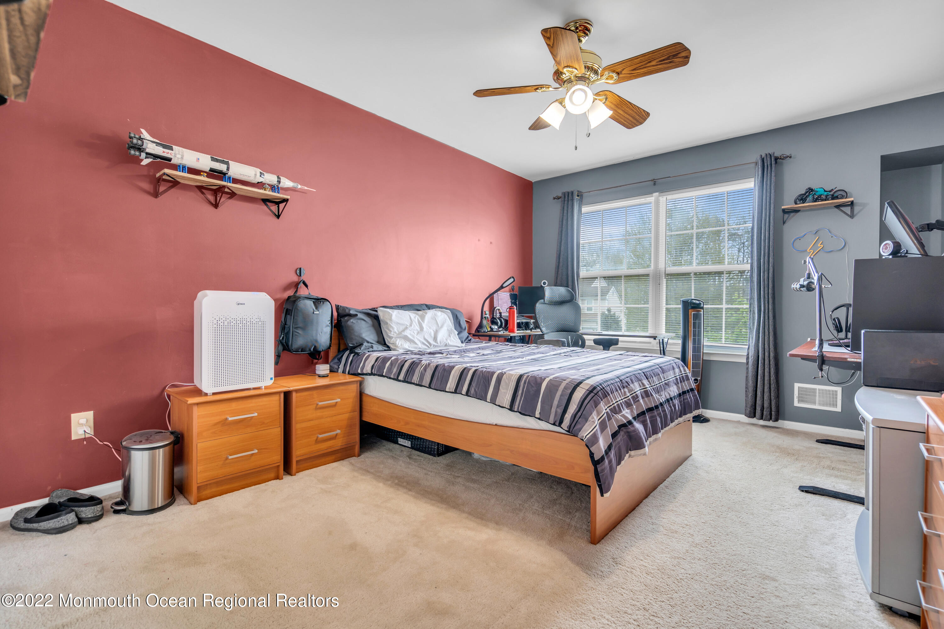 131 Nobility Court Toms River, NJ 08755 - Photo 42 of 60 a bedroom with a bed and a chandelier