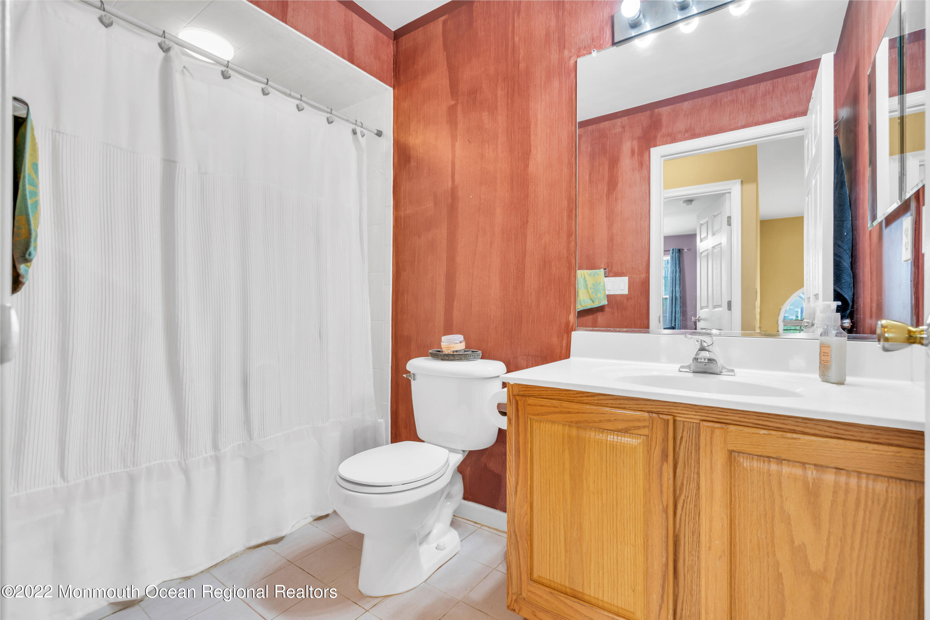 131 Nobility Court Toms River, NJ 08755 - Photo 43 of 60 a bathroom with a sink a toilet and a mirror