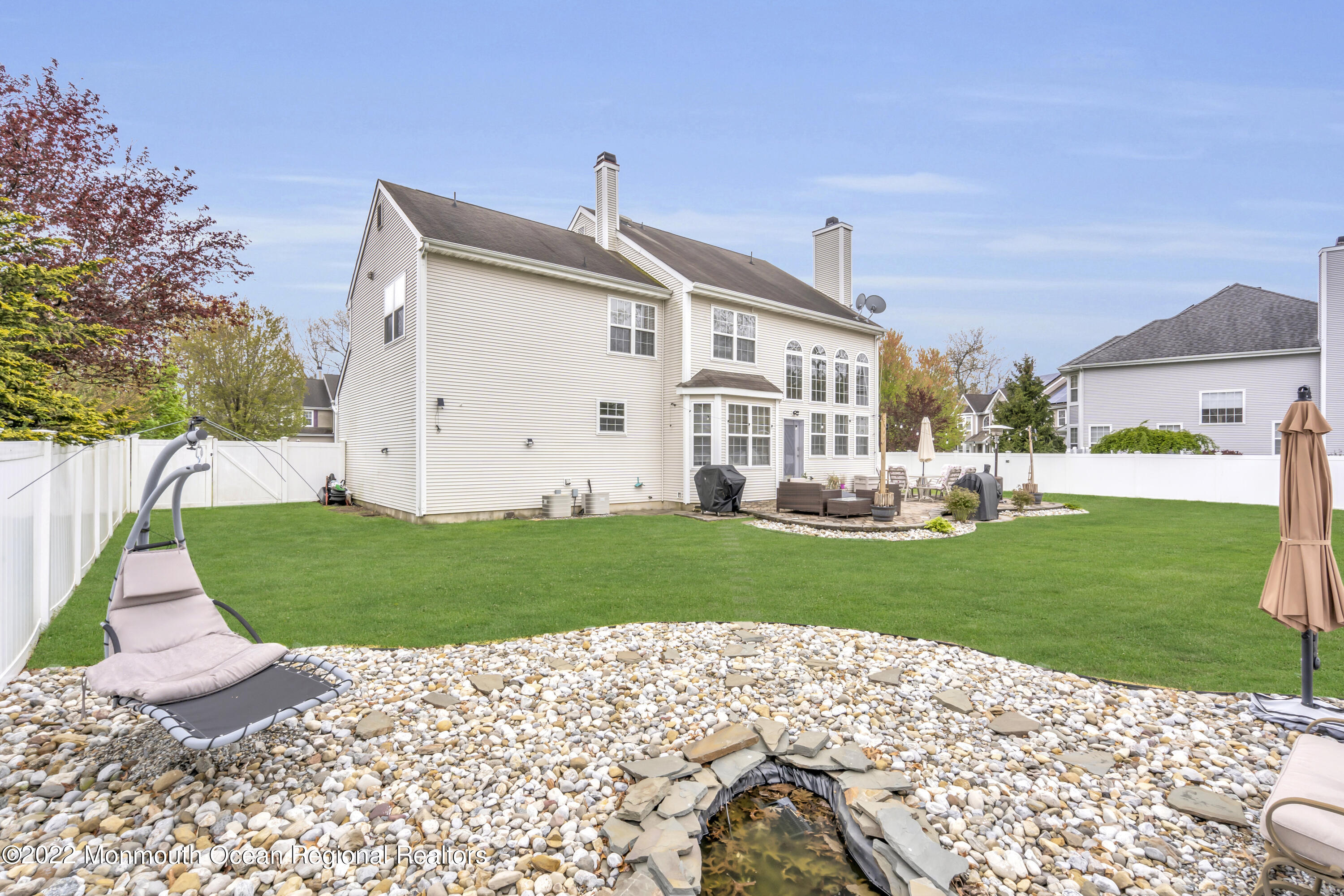 131 Nobility Court Toms River, NJ 08755 - Photo 52 of 60 a front view of a house with a yard