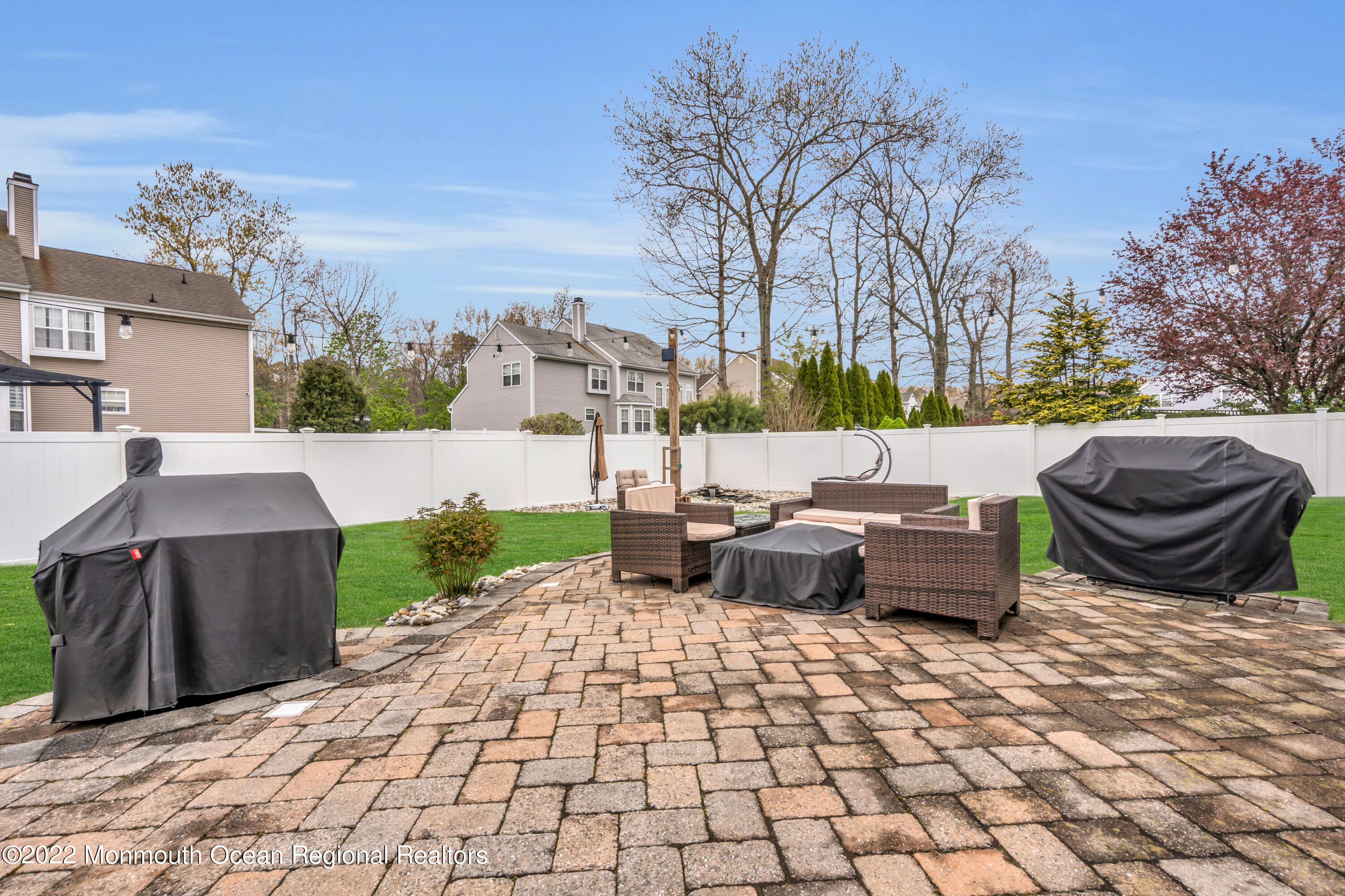 131 Nobility Court Toms River, NJ 08755 - Photo 55 of 60 a view of a patio with table and chairs couches with wooden fence
