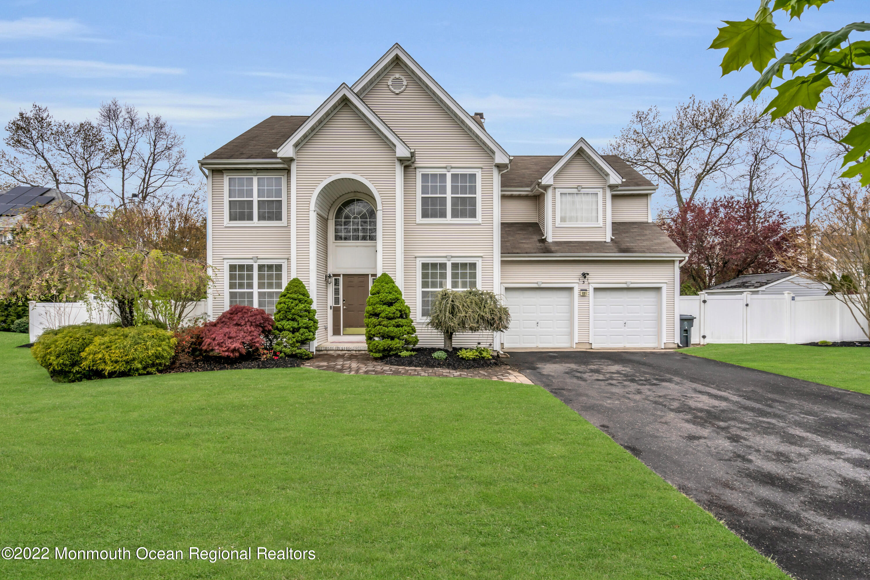 131 Nobility Court Toms River, NJ 08755 - Photo 58 of 60 a front view of a house with a garden and plants