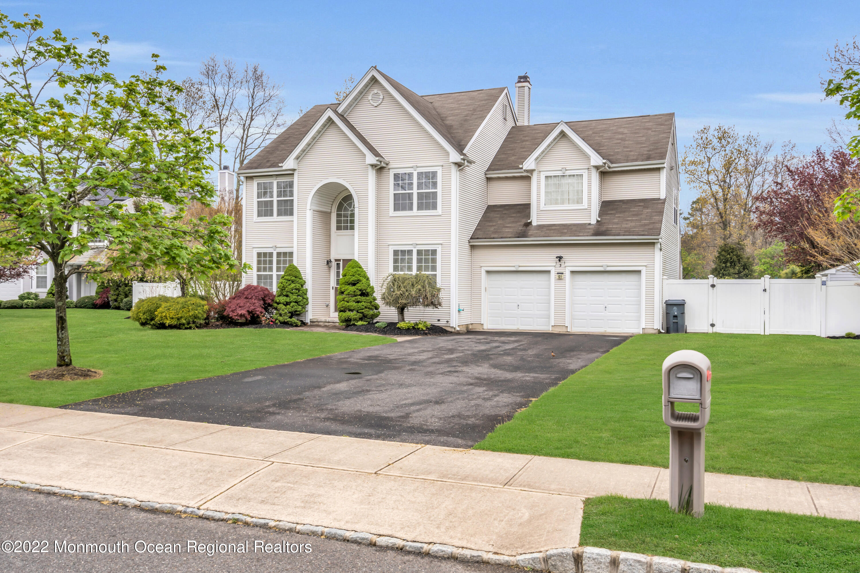 131 Nobility Court Toms River, NJ 08755 - Photo 59 of 60 a front view of a house with a yard and garage