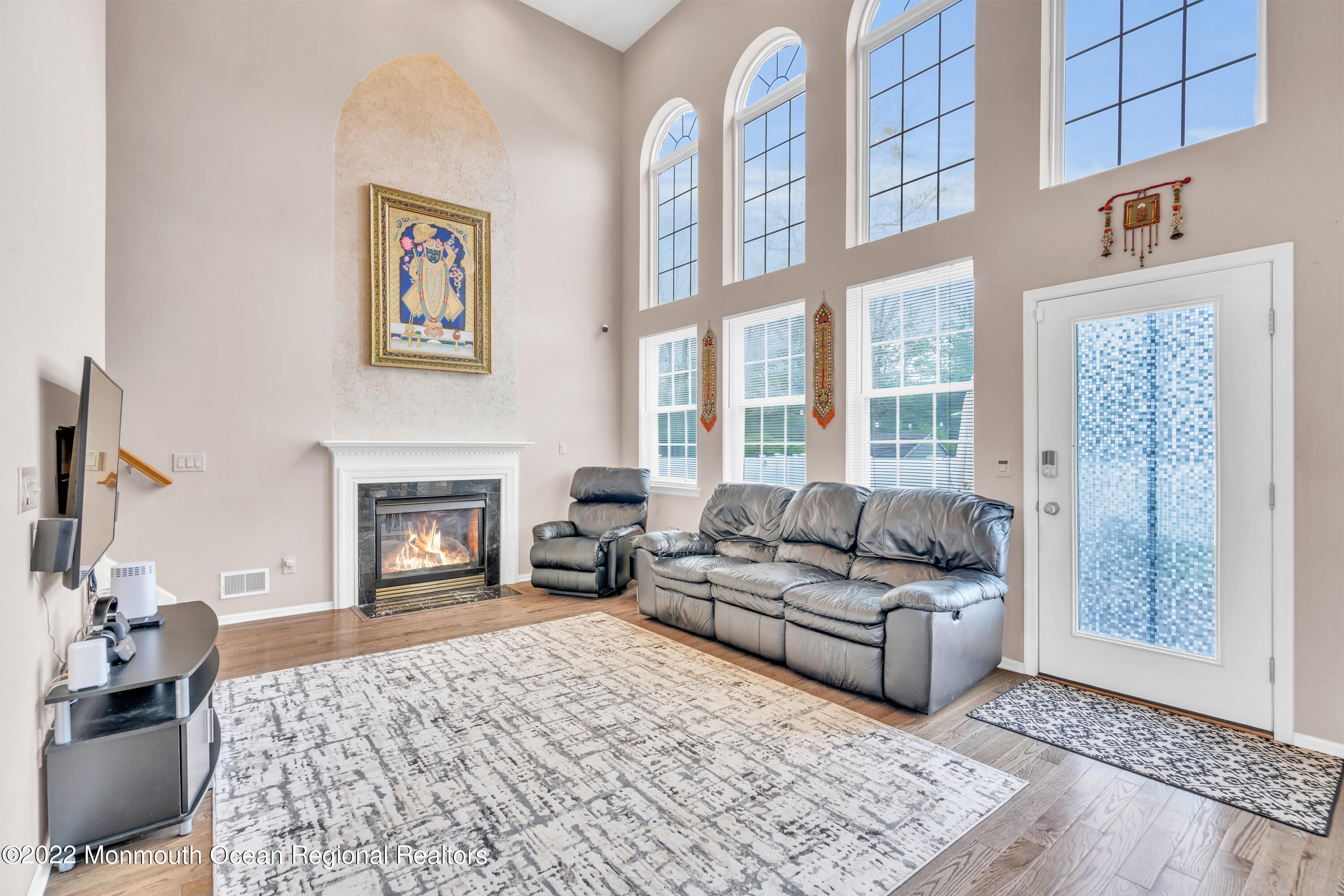 131 Nobility Court Toms River, NJ 08755 - Photo 7 of 60 a living room with furniture and a fireplace