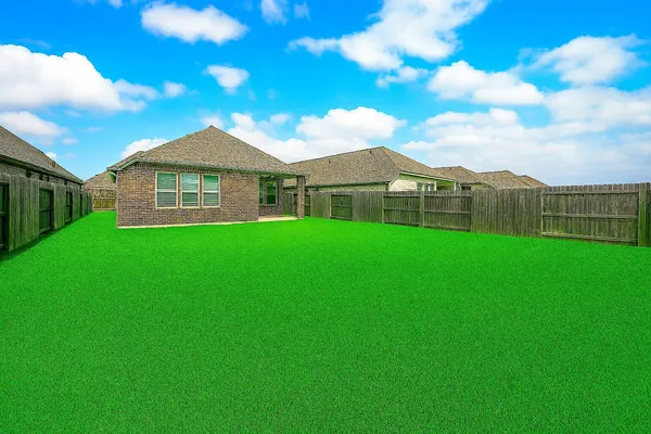 an aerial view of a house with garden space and street view