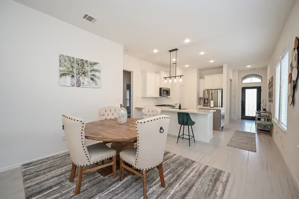 a view of a dining room with furniture