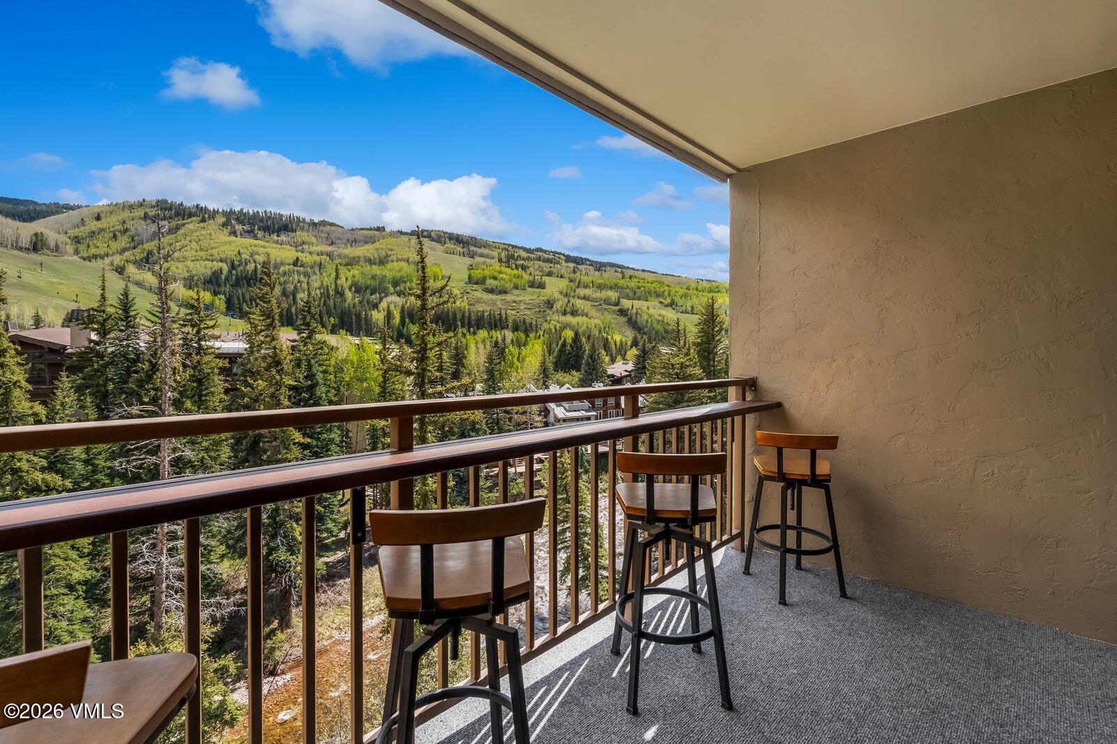 500 South Frontage Road East, Unit 308 Vail, CO 81657 - Photo 17 of 25 a view of a chairs and table in the balcony
