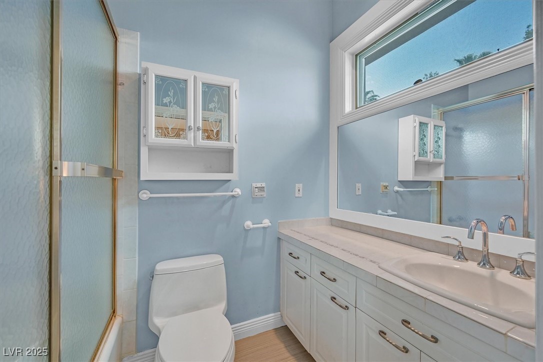 3372 Westwind Road Las Vegas, NV 89146 - Photo 7 of 39 Bathroom featuring vanity and combined bath / shower with glass door