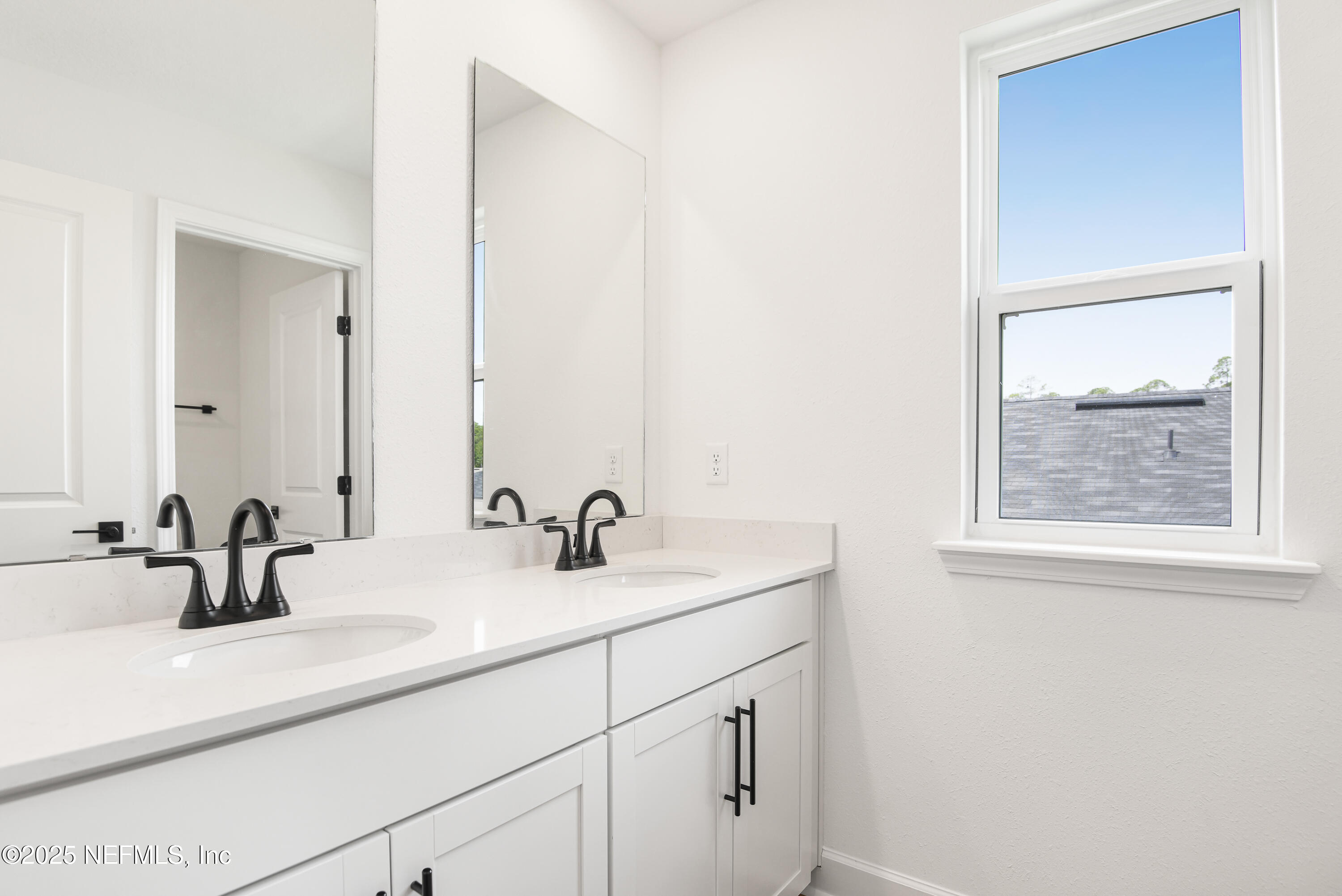 97 Arbor Alcove Lane St. Augustine, FL 32084 - Photo 16 of 22 a bathroom with a sink and a mirror