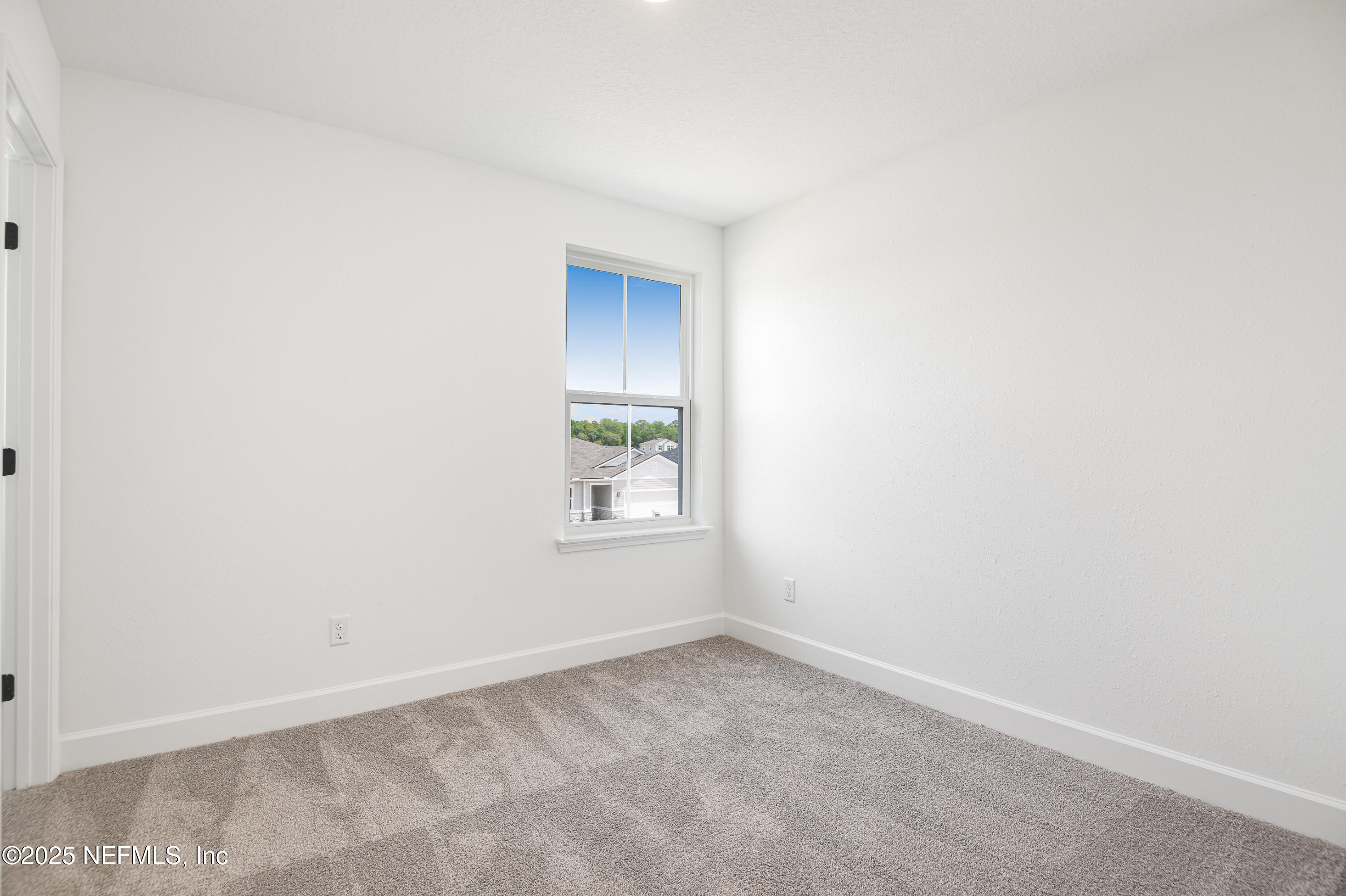 97 Arbor Alcove Lane St. Augustine, FL 32084 - Photo 17 of 22 an empty room with a window
