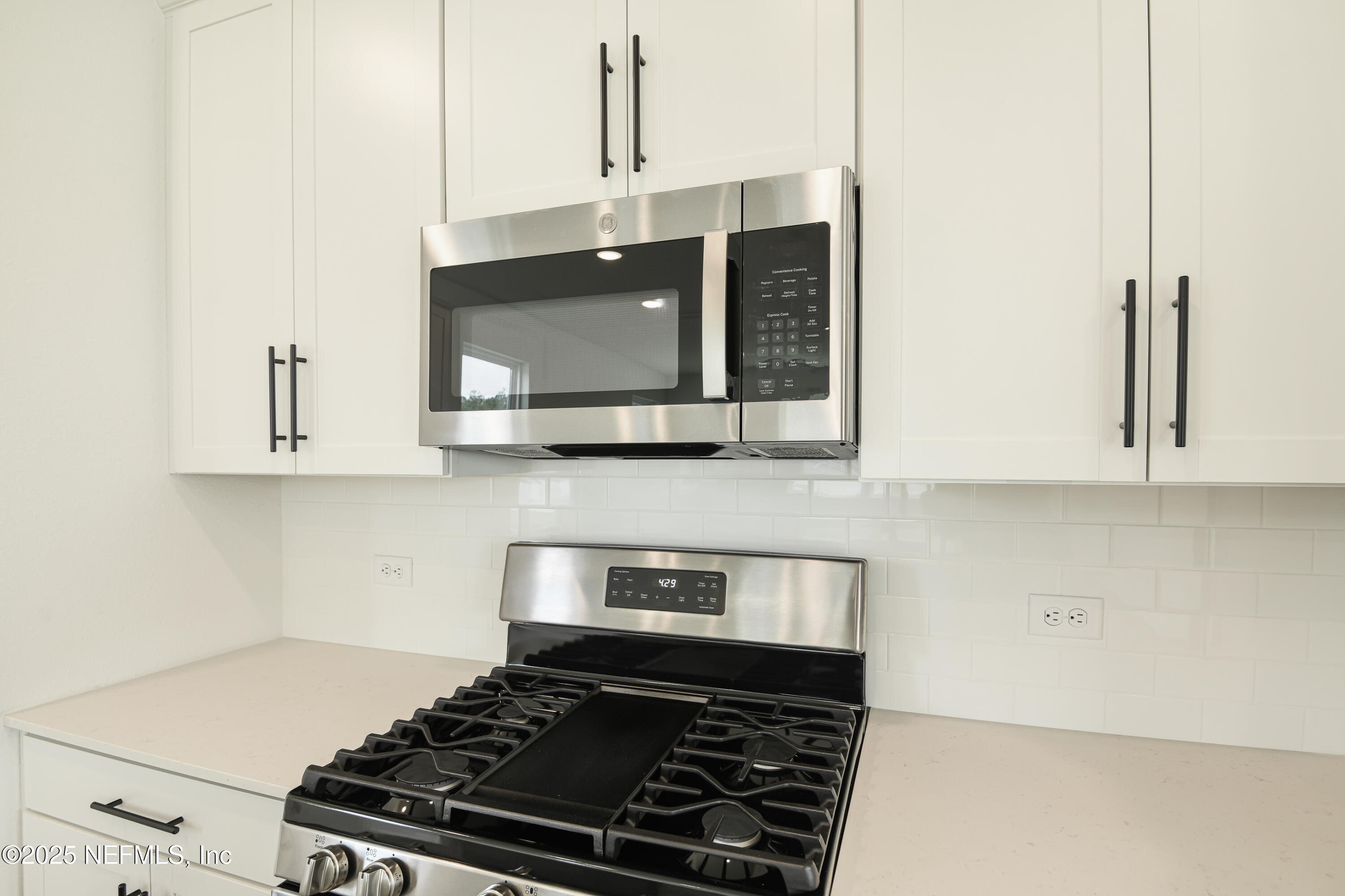 97 Arbor Alcove Lane St. Augustine, FL 32084 - Photo 5 of 22 a stove top oven sitting inside of a kitchen