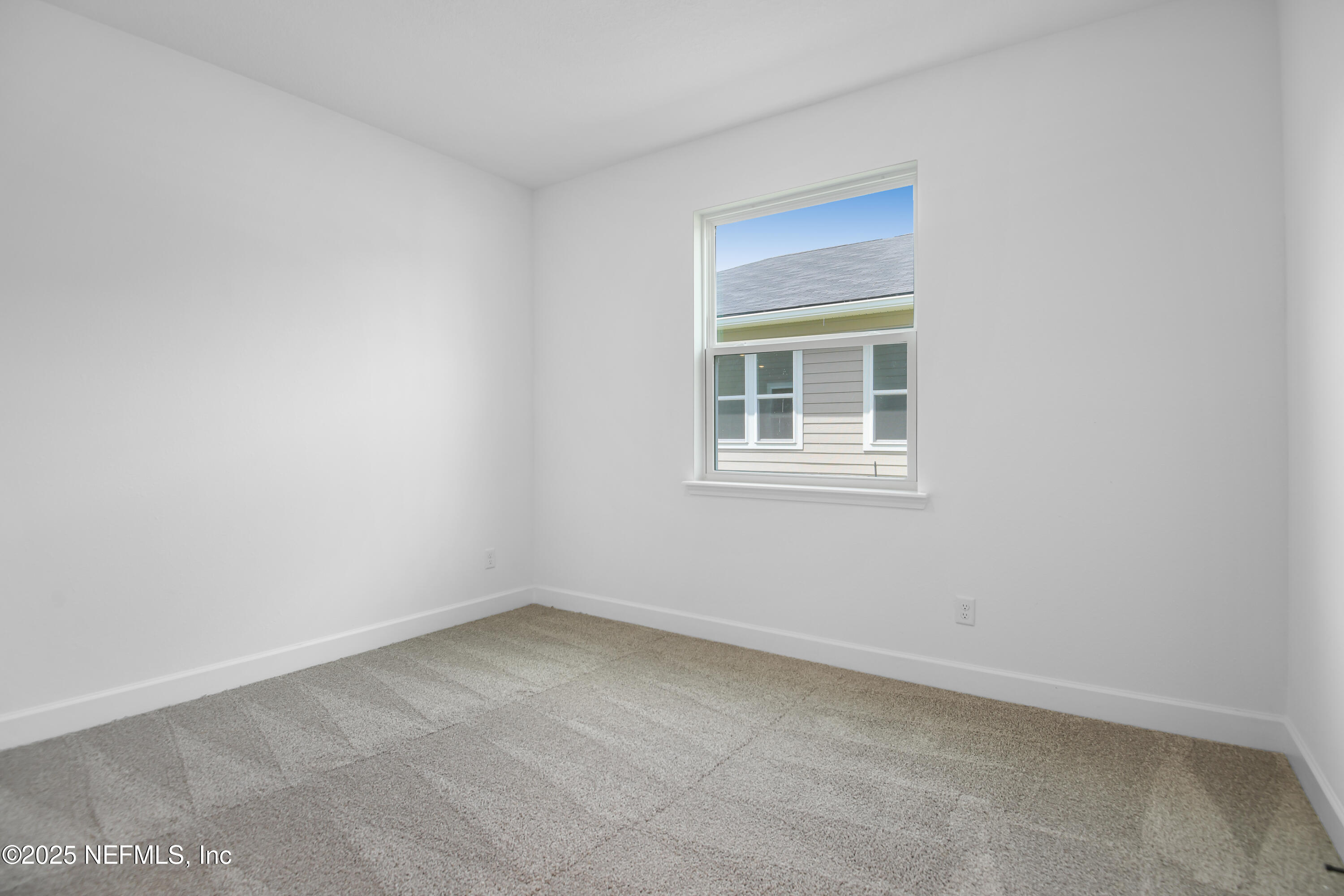 97 Arbor Alcove Lane St. Augustine, FL 32084 - Photo 9 of 22 an empty room with a window