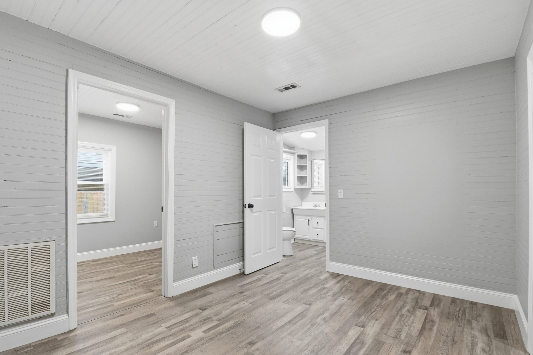 612 Maple Street Manchester, TN 37355 - Photo 11 of 20 wooden floor in an empty room with a window