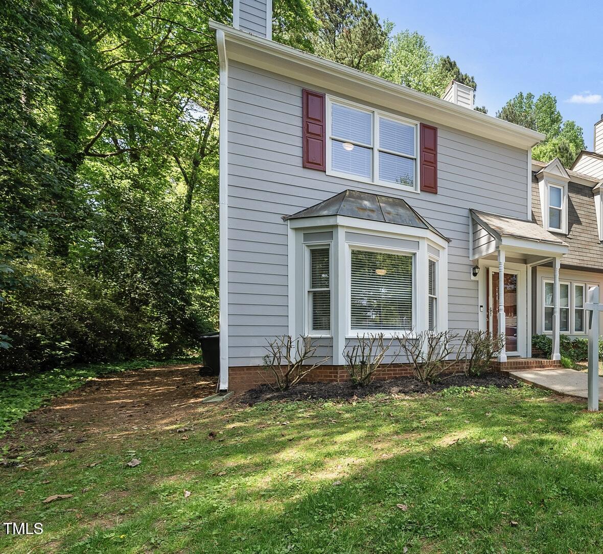 710 Powell Drive, Unit F Raleigh, NC 27606 - Photo 1 of 32 front view of a house with a yard