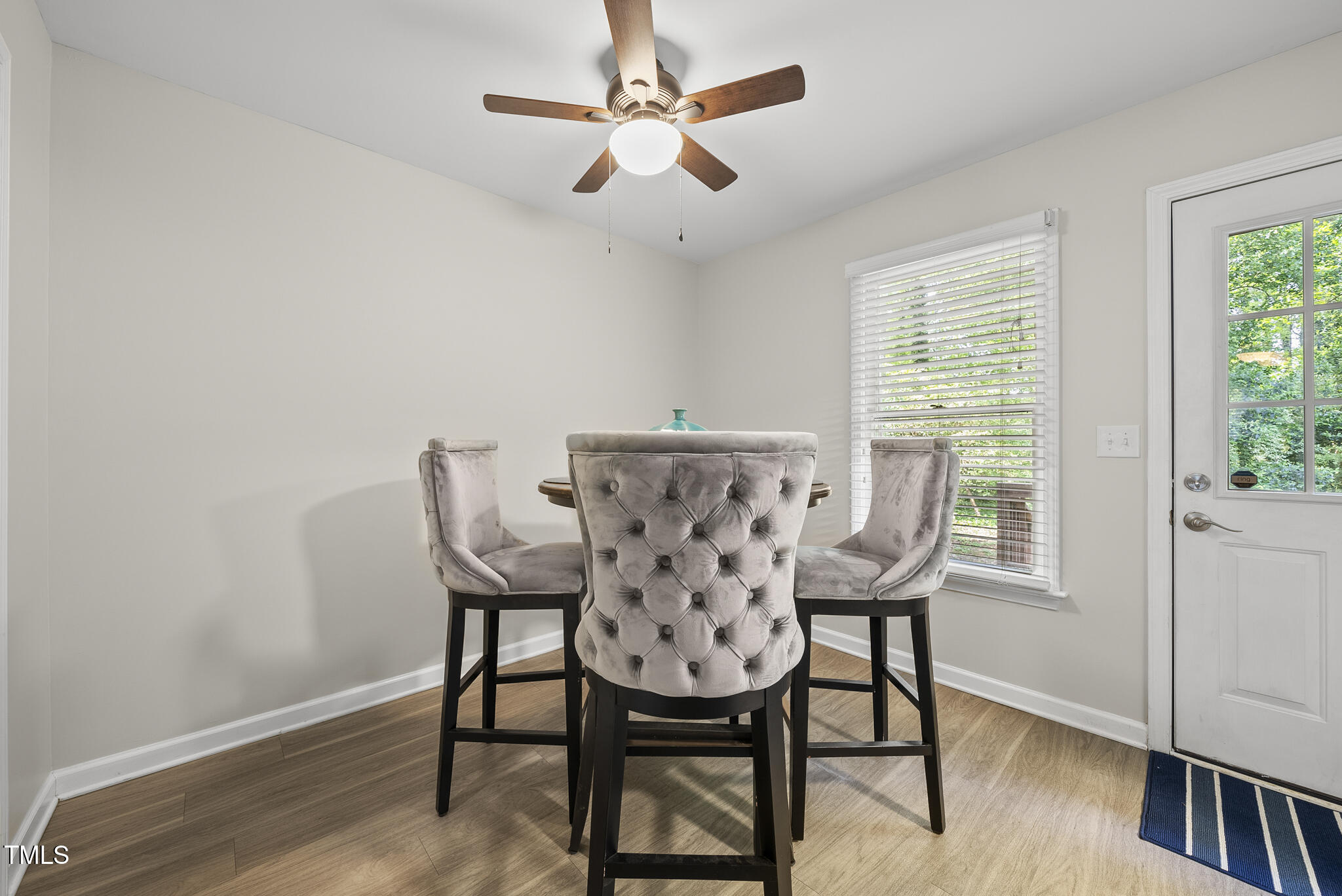 710 Powell Drive, Unit F Raleigh, NC 27606 - Photo 10 of 32 a view of a dining room with furniture window and wooden floor