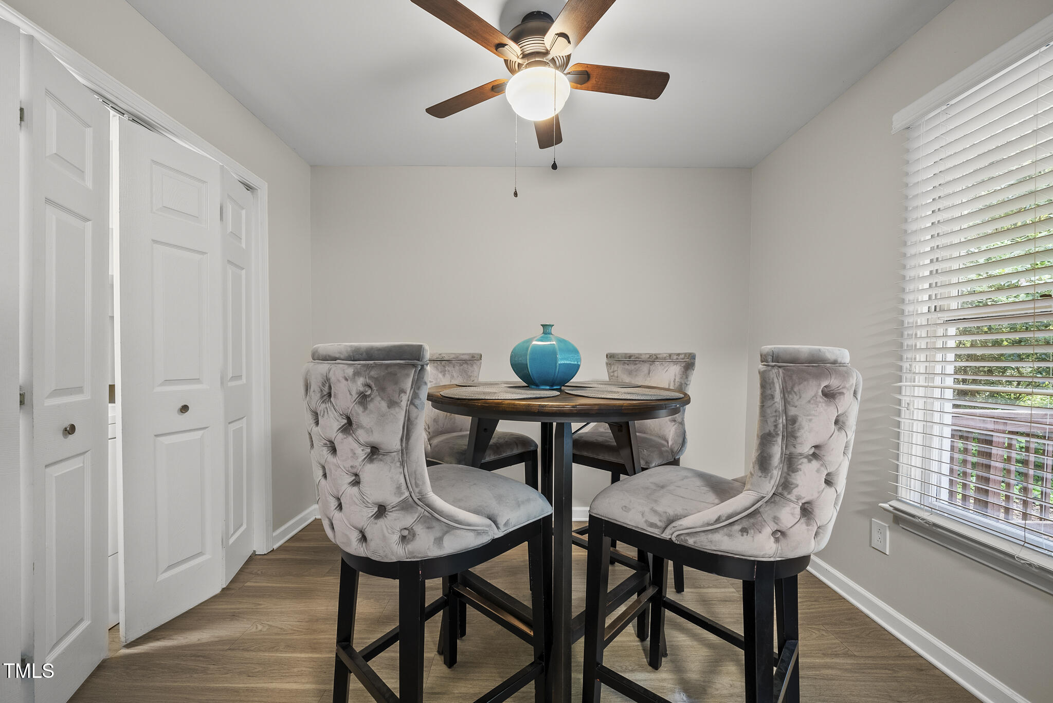 710 Powell Drive, Unit F Raleigh, NC 27606 - Photo 11 of 32 a view of a dining room with furniture and wooden floor