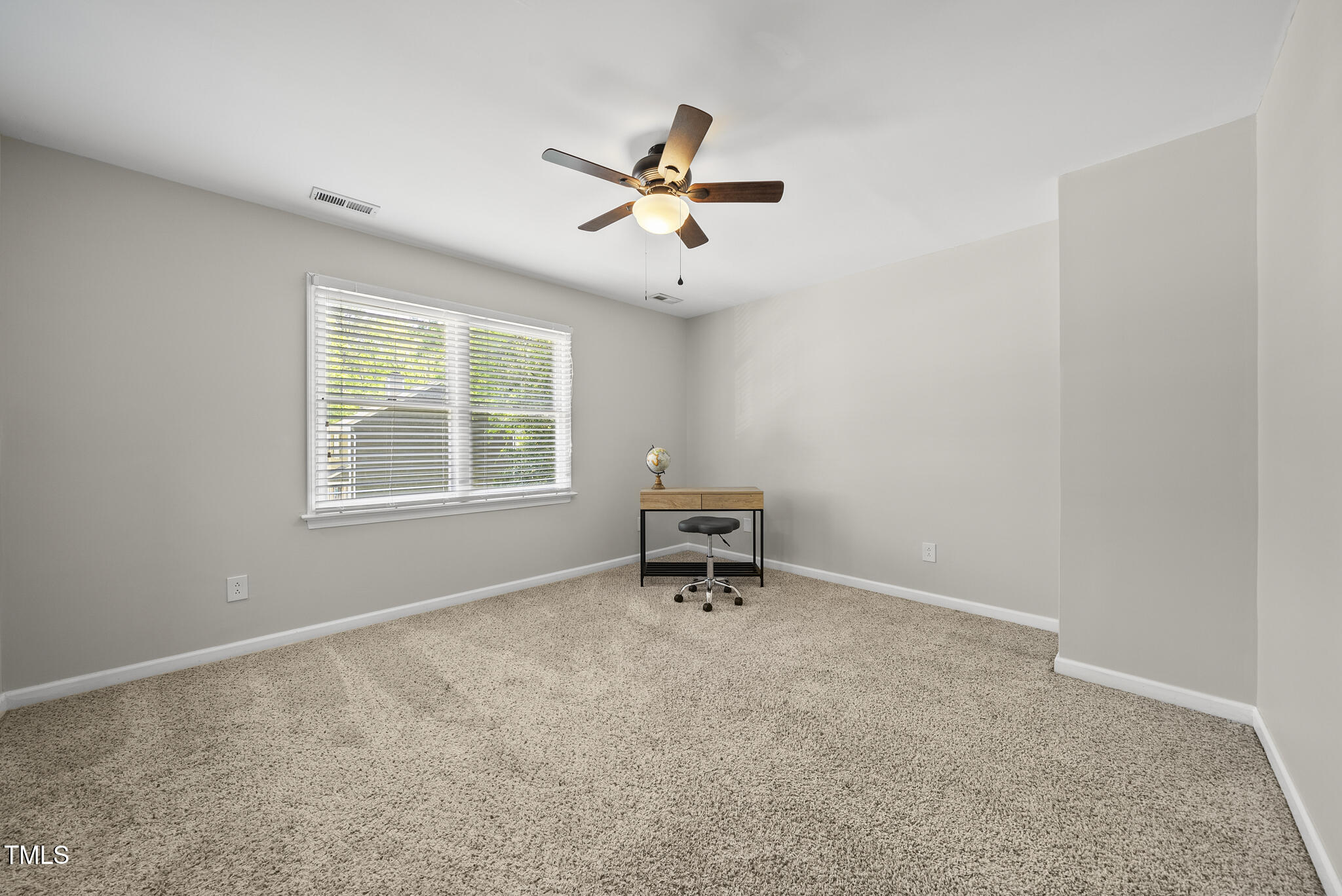 710 Powell Drive, Unit F Raleigh, NC 27606 - Photo 22 of 32 a view of an empty room with a window