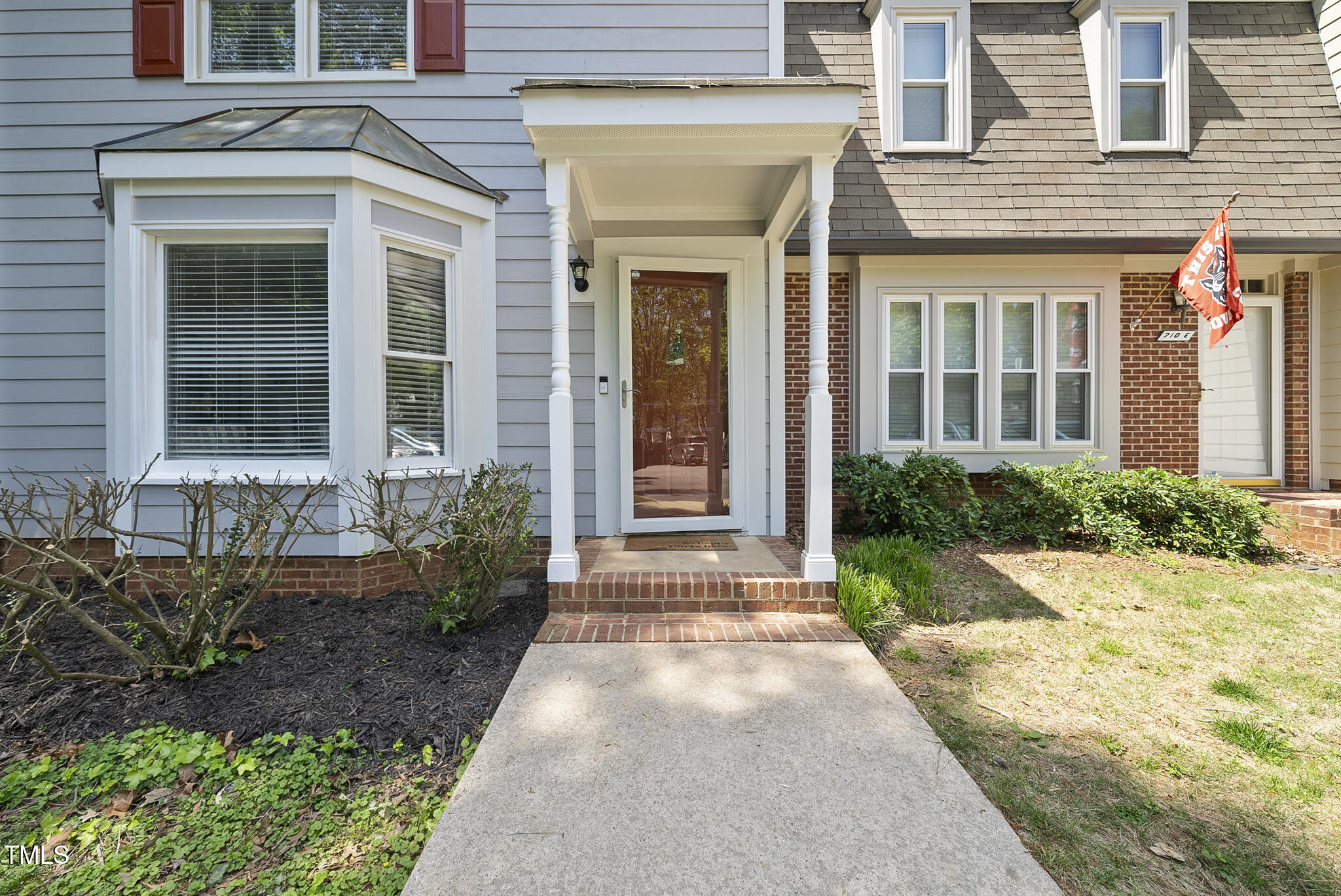 710 Powell Drive, Unit F Raleigh, NC 27606 - Photo 30 of 32 a front view of a house with a yard