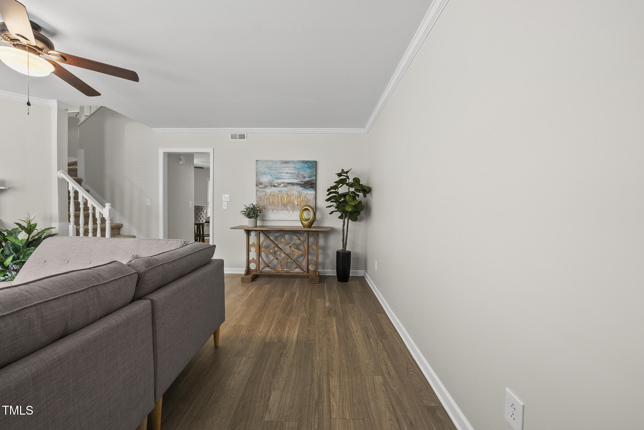 710 Powell Drive, Unit F Raleigh, NC 27606 - Photo 5 of 32 a living room with furniture and a wooden floor