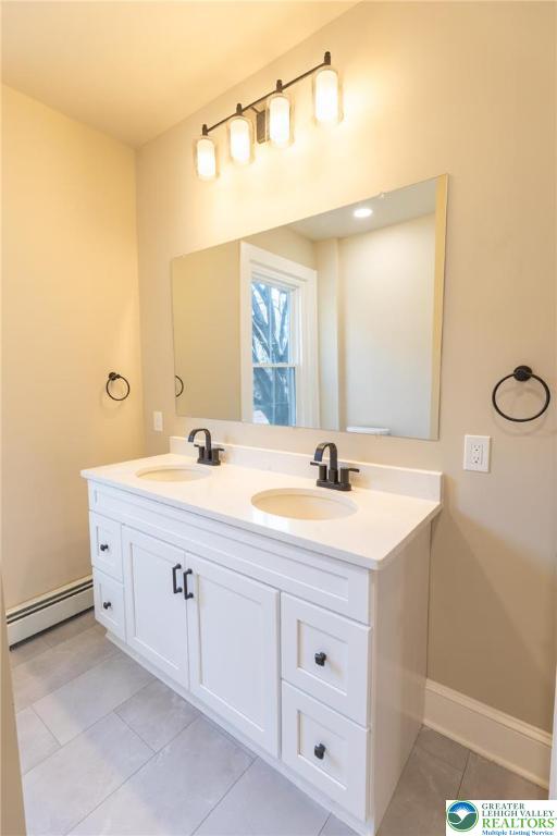 708 Main Street, Unit 2 Bethlehem, PA 18018 - Photo 15 of 18 a bathroom with a sink vanity and mirror