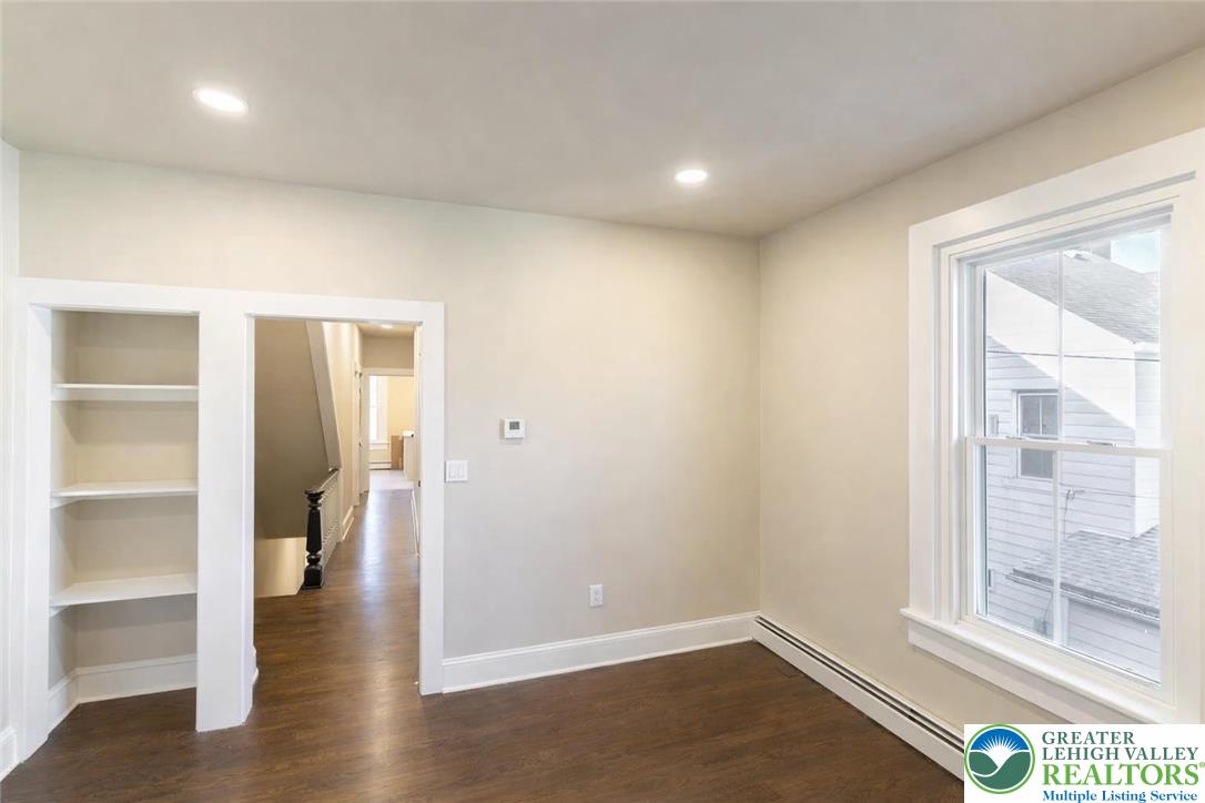708 Main Street, Unit 2 Bethlehem, PA 18018 - Photo 5 of 18 wooden floor in an empty room with a window