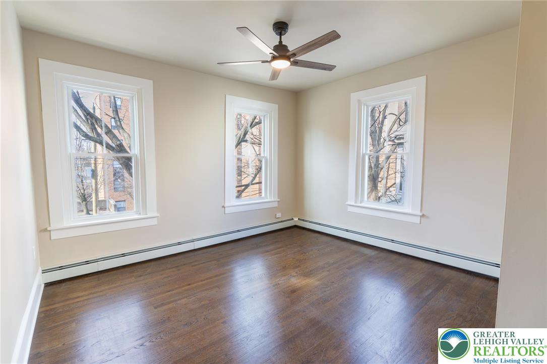 708 Main Street, Unit 2 Bethlehem, PA 18018 - Photo 9 of 18 a view of an empty room with wooden floor and a window