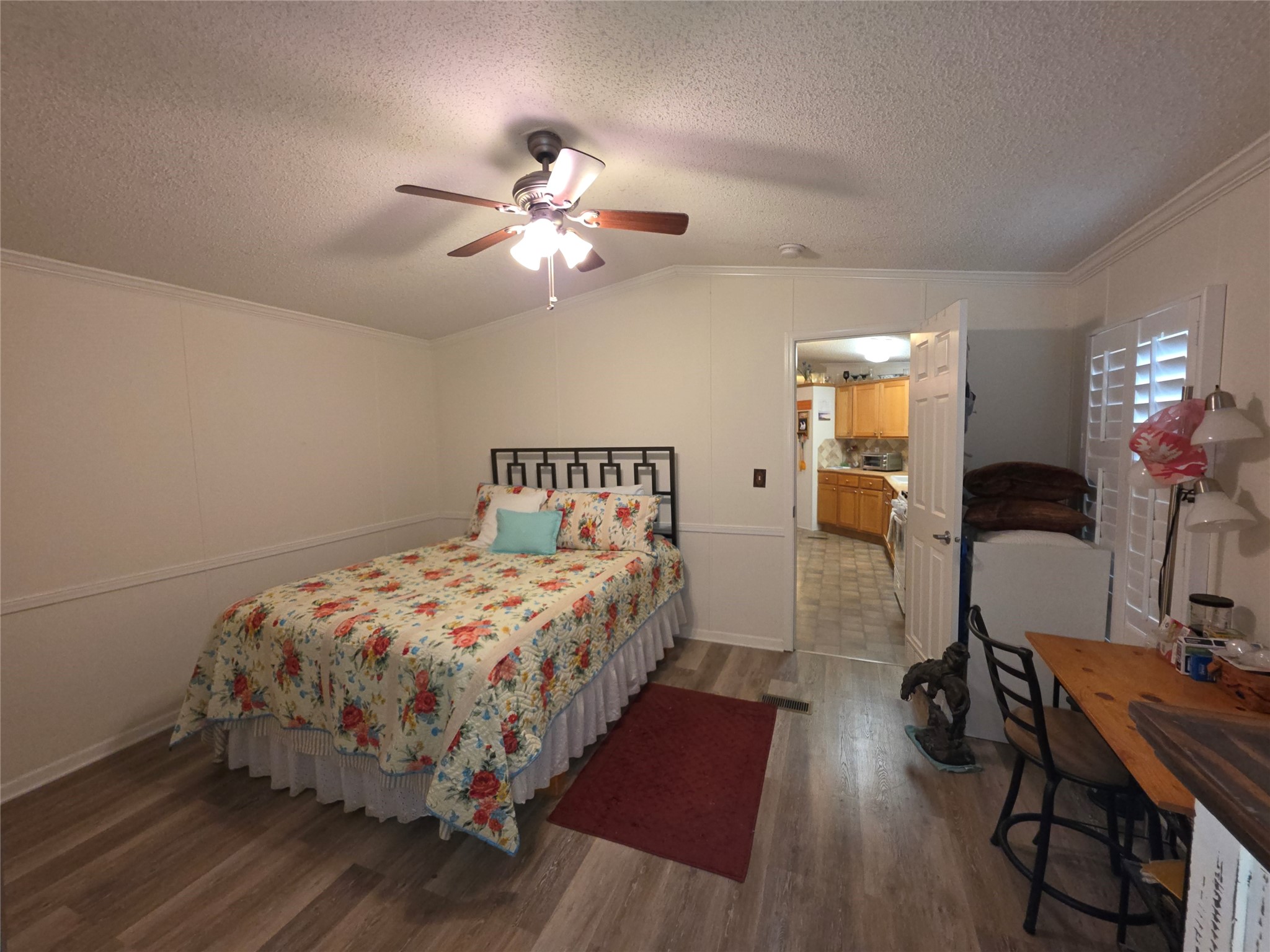 70 Montego Way Point Blank, TX 77364 - Photo 9 of 41 a bedroom with bed and a chandelier