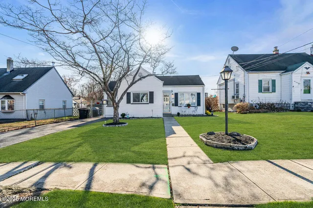 a kitchen with stainless steel appliances a sink a stove and cabinets