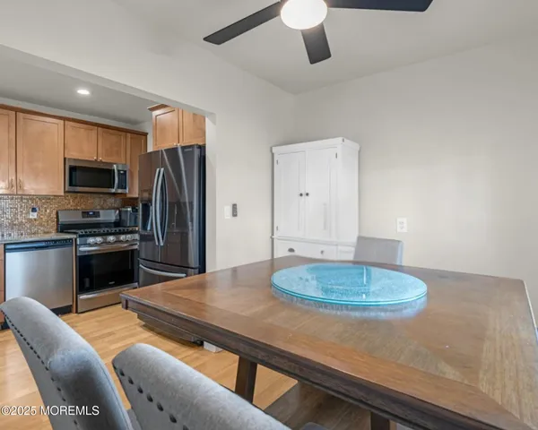 a dining room with a table and chairs