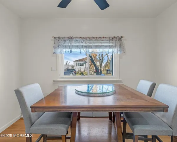 a kitchen with a refrigerator a sink and cabinets