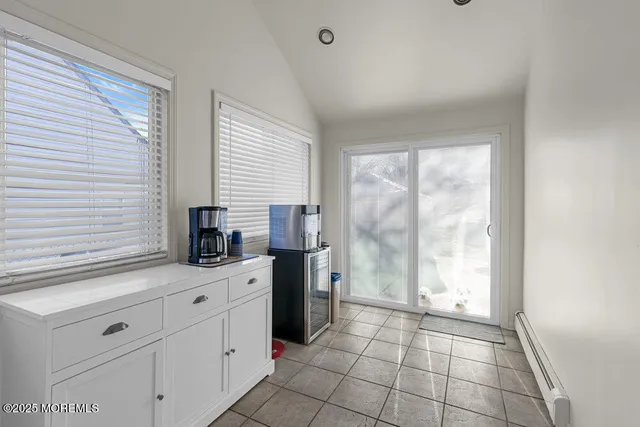 a kitchen with stainless steel appliances a refrigerator sink and cabinets